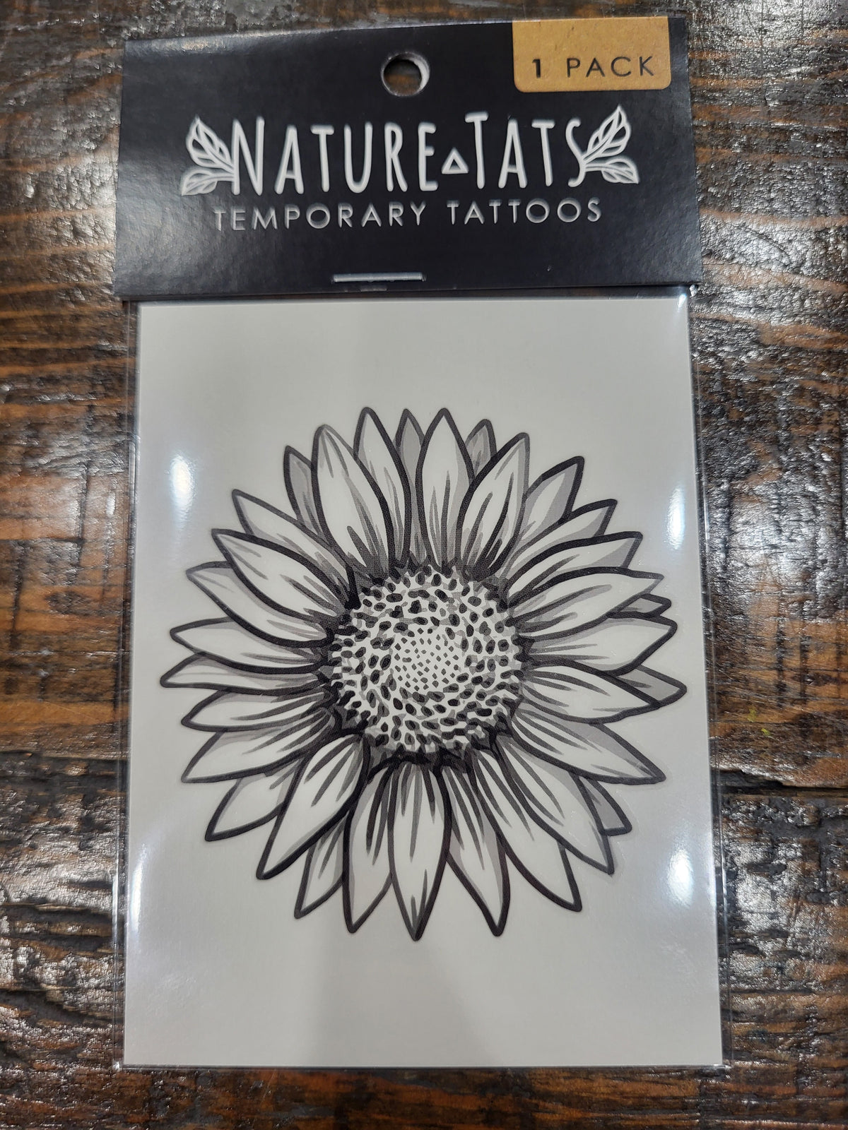 Sunflower temporary tattoo sheet, black line art with dotted middle in 1 pack.