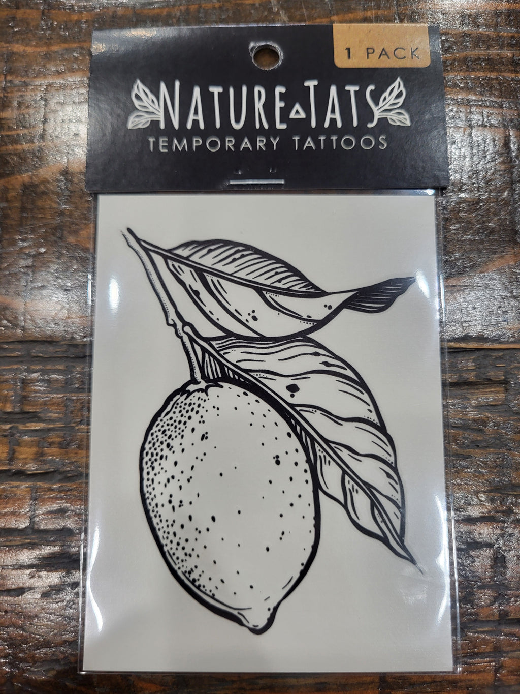 Temporary tattoo pack showing lemon and leaf line-art design