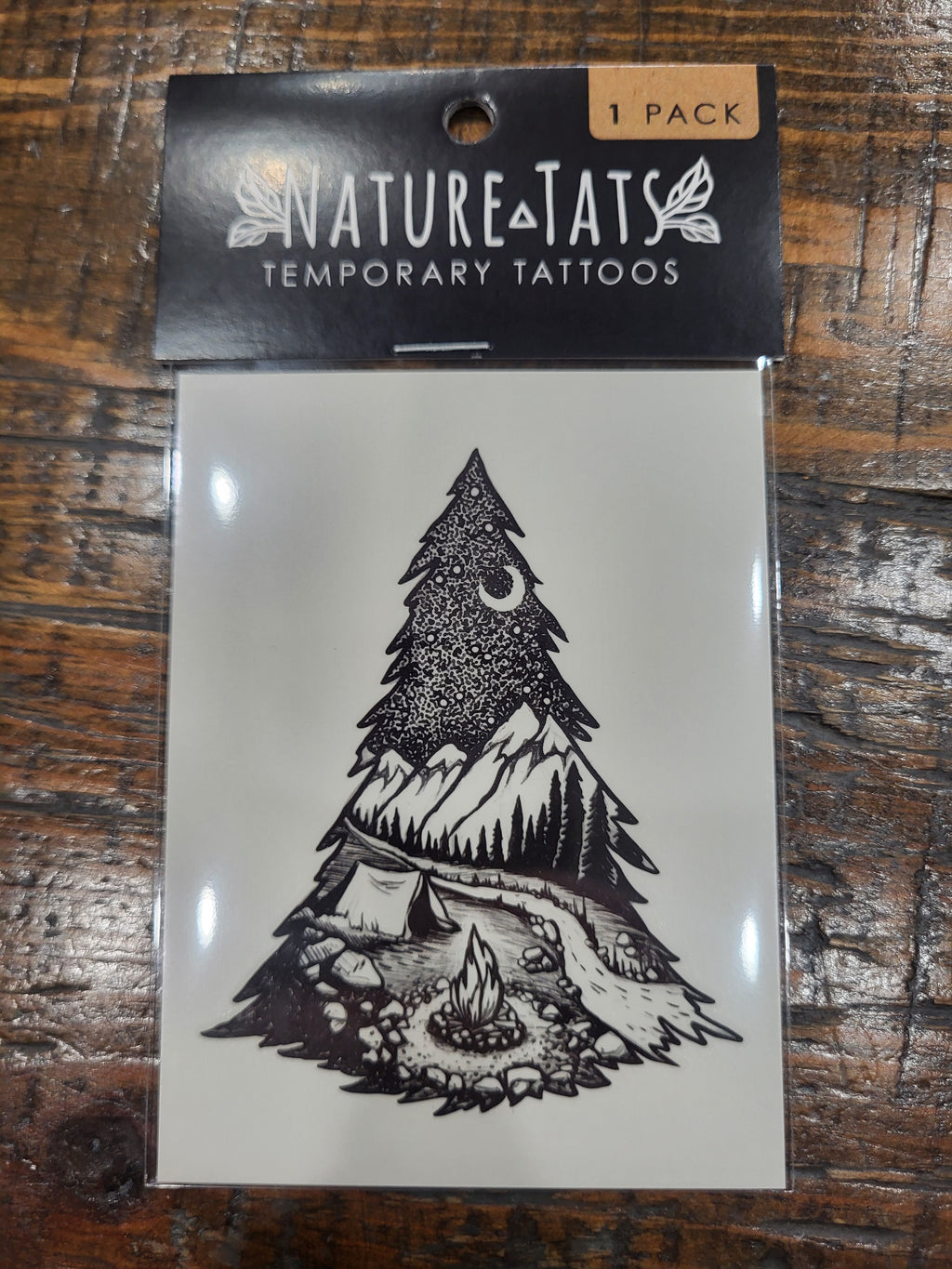 Temporary tattoo pack showing black pine tree camping artwork, 1 pack.