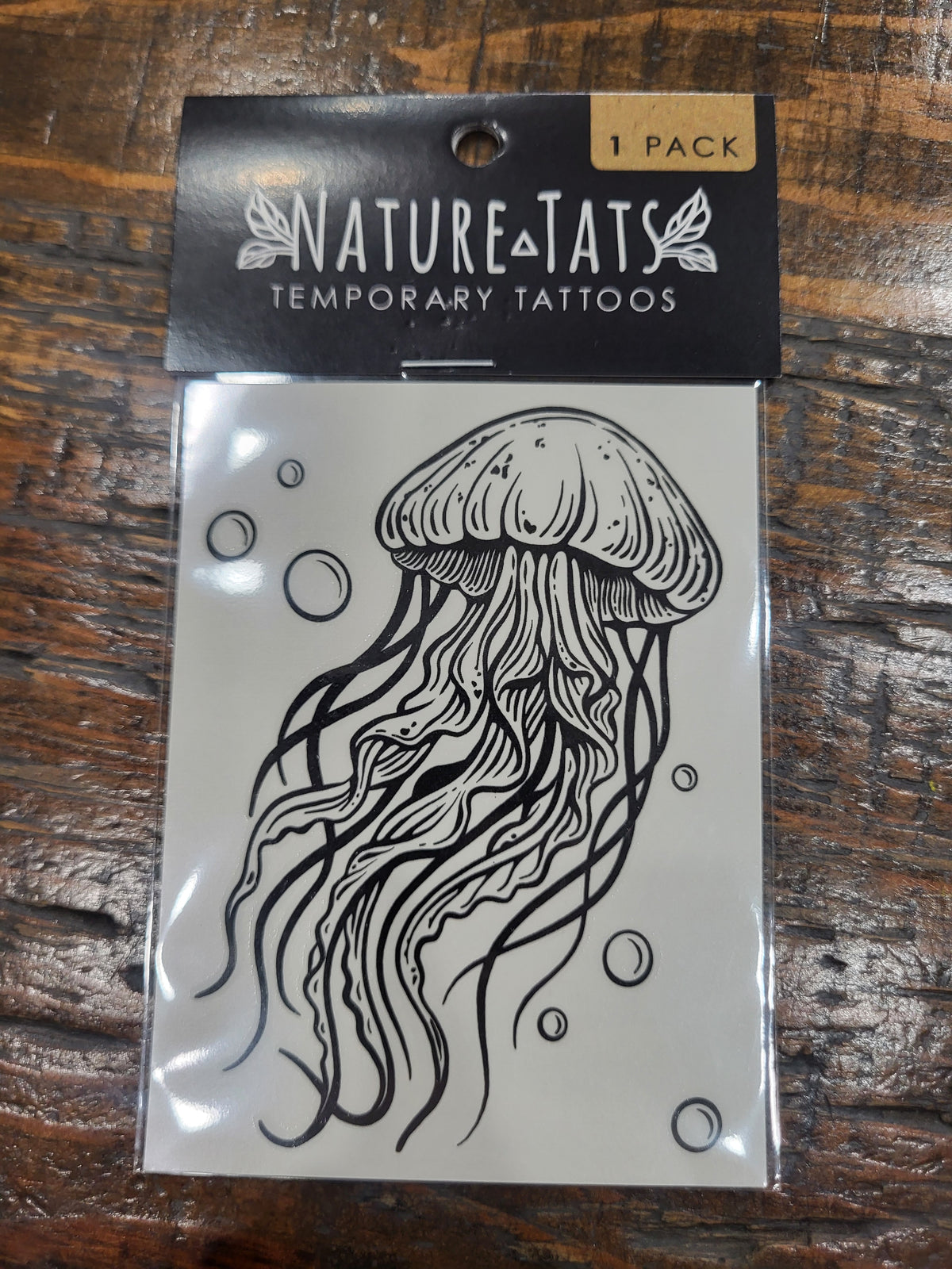 Jellyfish temporary tattoo pack, black jellyfish line art on white sheet