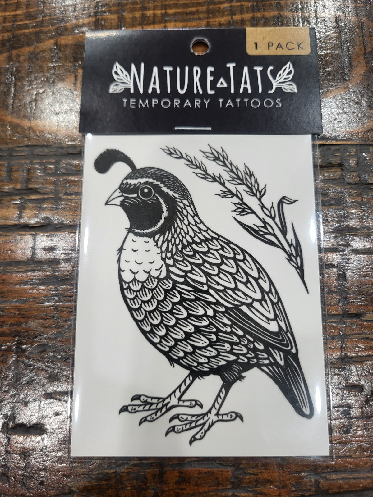 Quail temporary tattoo pack showing a black quail with branch design