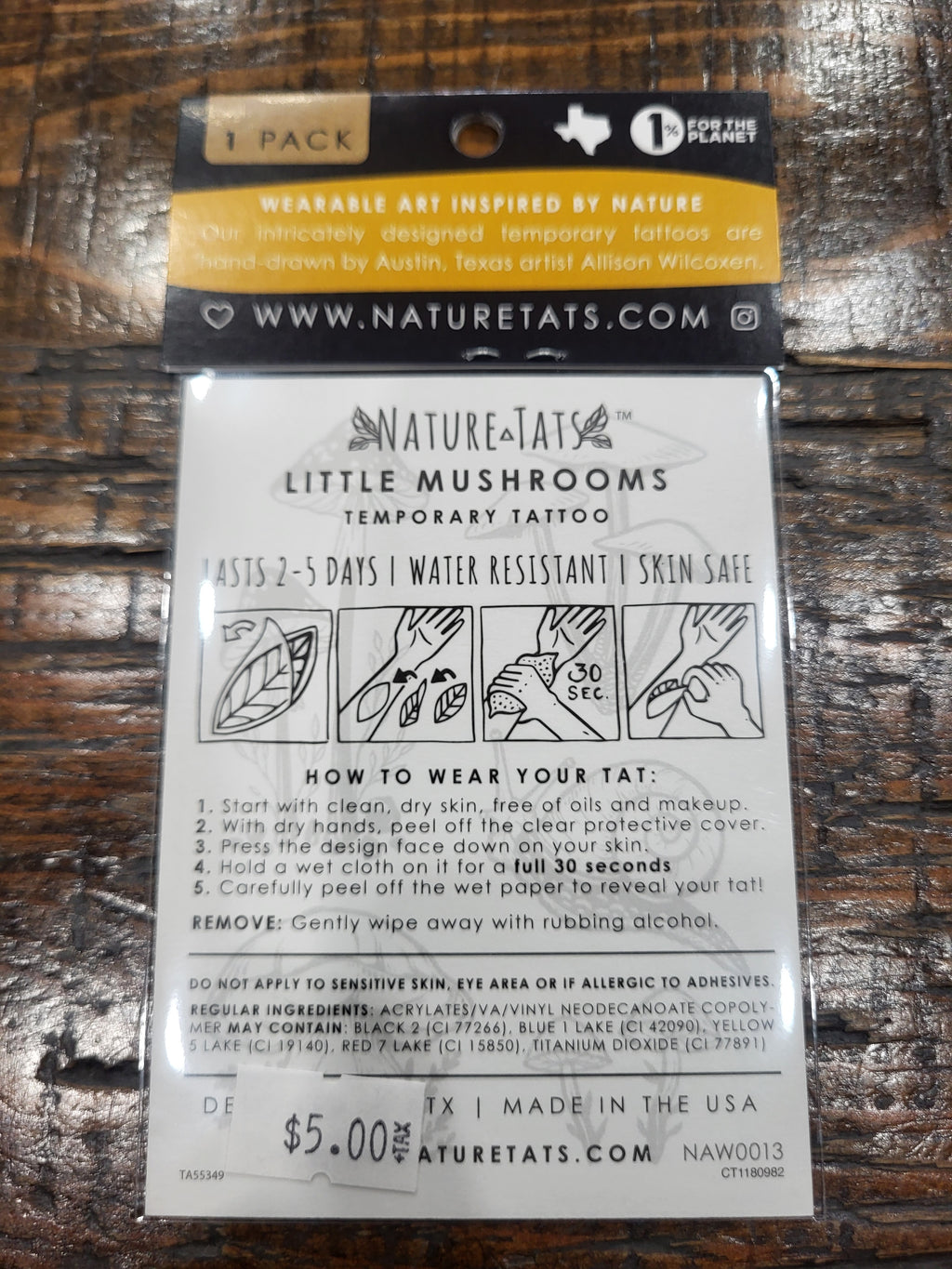 Temporary tattoo sheet back with Little Mushrooms label and wear instructions