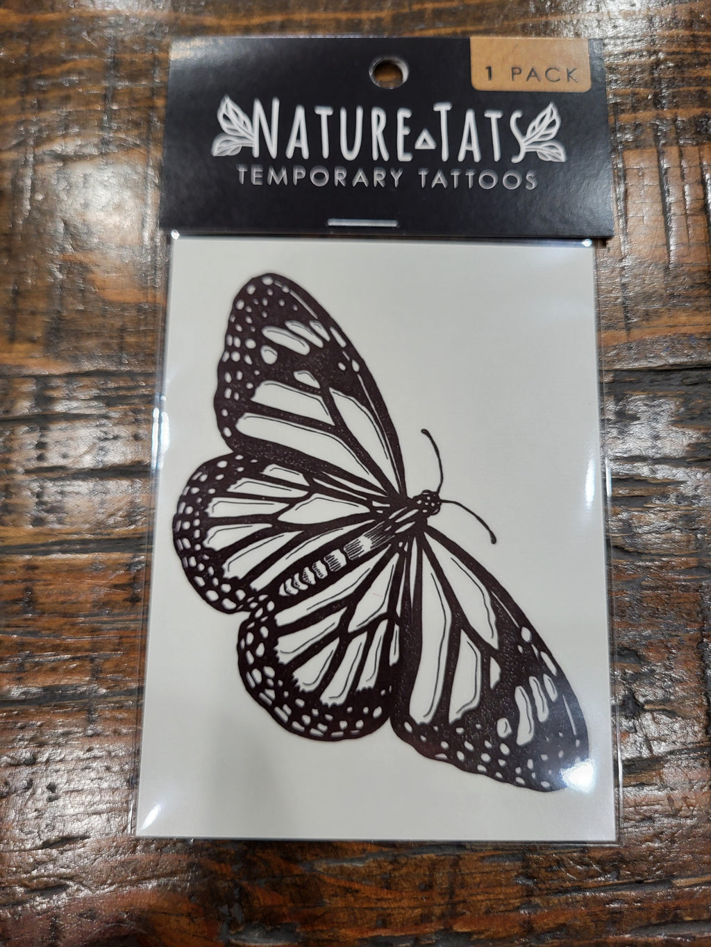 Monarch butterfly temporary tattoo pack, black butterfly design on NatureTats label