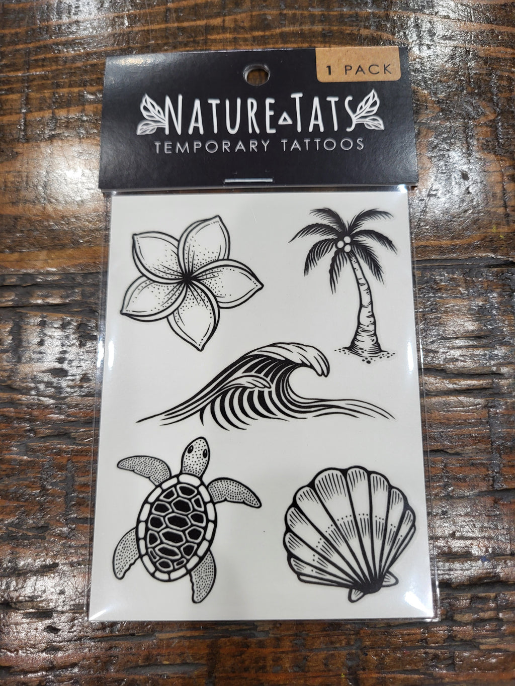 Temporary tattoo pack with beach motifs: orchid, palm tree, turtle, seashell