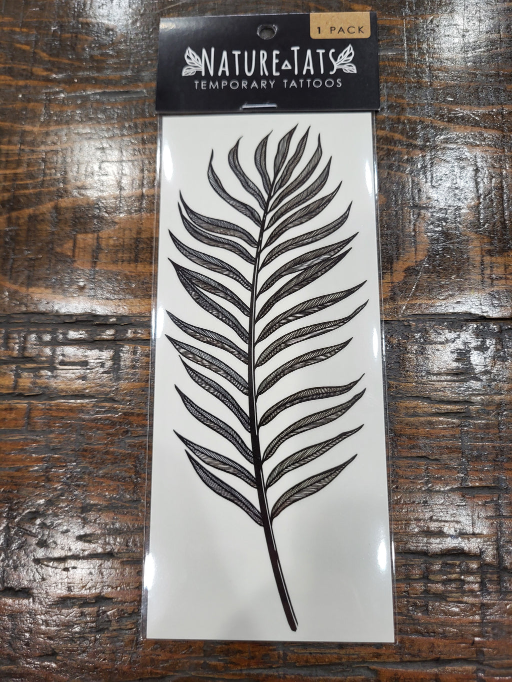 Palm leaf temporary tattoo sheet in pack, black leaf graphic