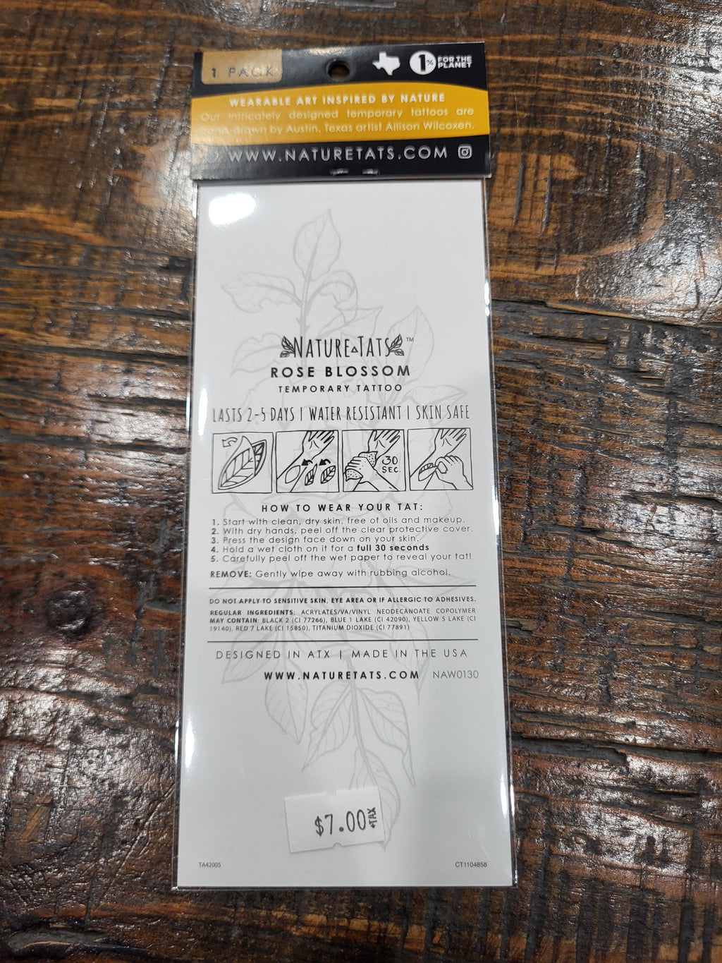 Temporary tattoo pack back with care instructions and rose blossom graphic