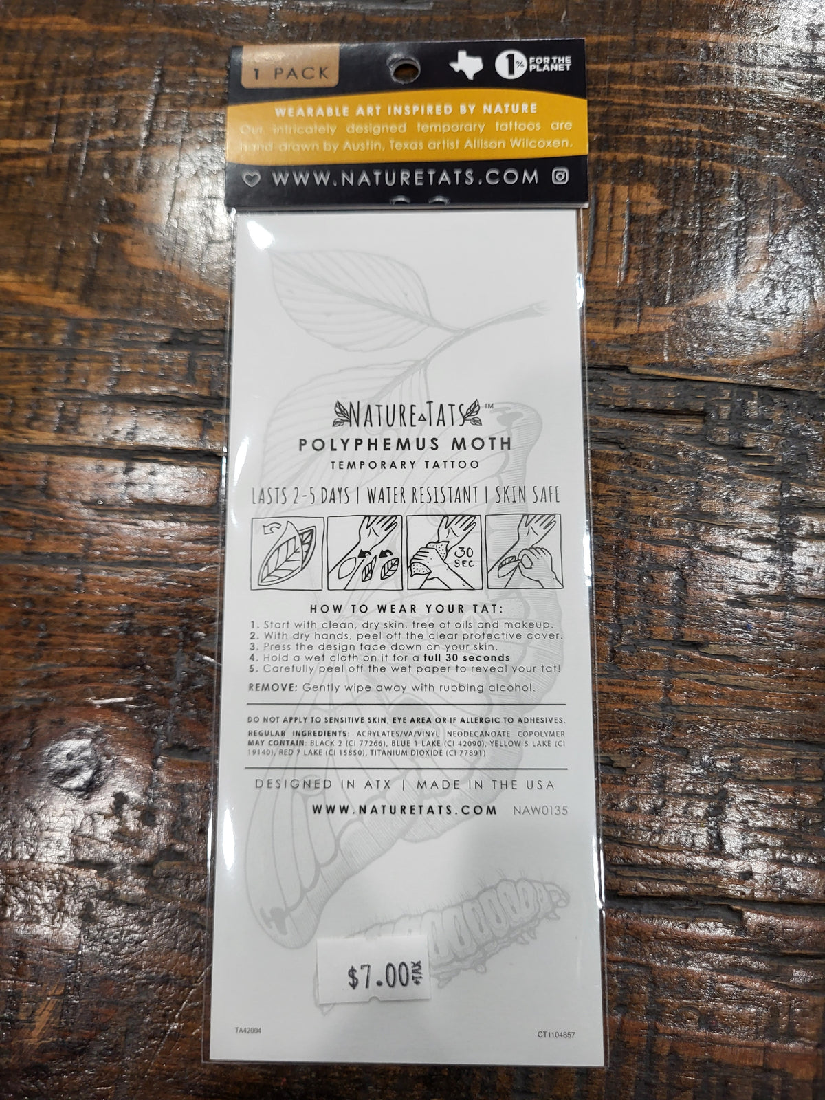 Temporary tattoo packaging back with moth outline and application instructions