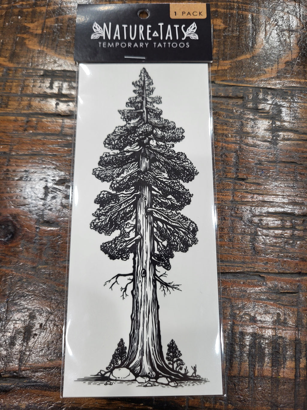 Temporary tattoo pack front with a dark pine tree illustration, NatureTats 1 pack