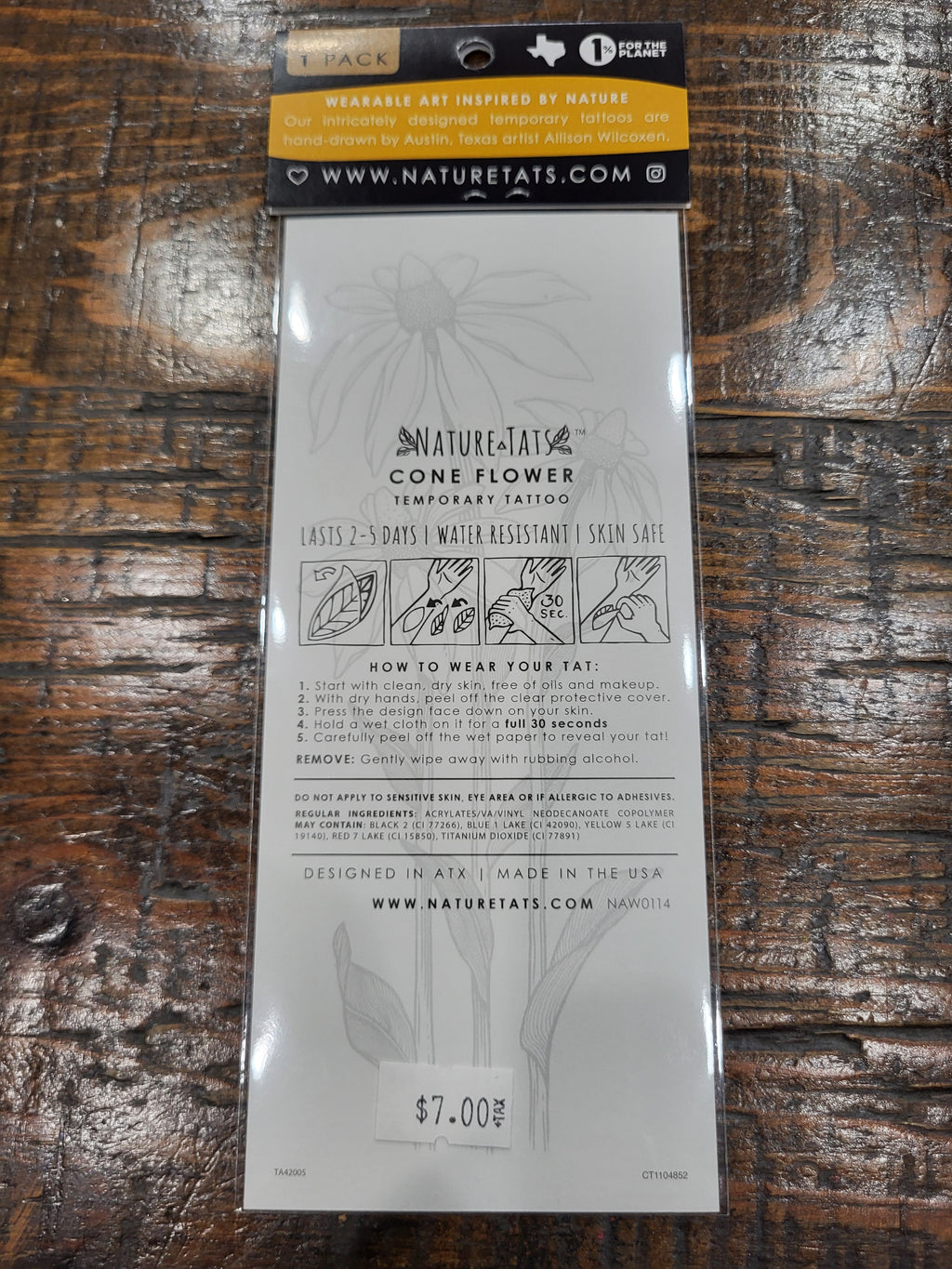 Temporary tattoo pack with coneflower line-art design on back card