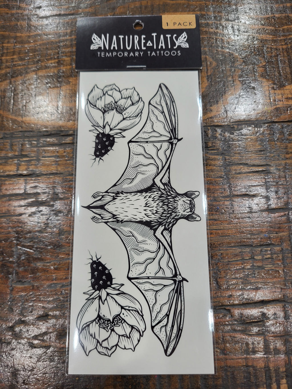 Free-tailed bat temporary tattoo sheet with floral line-art design