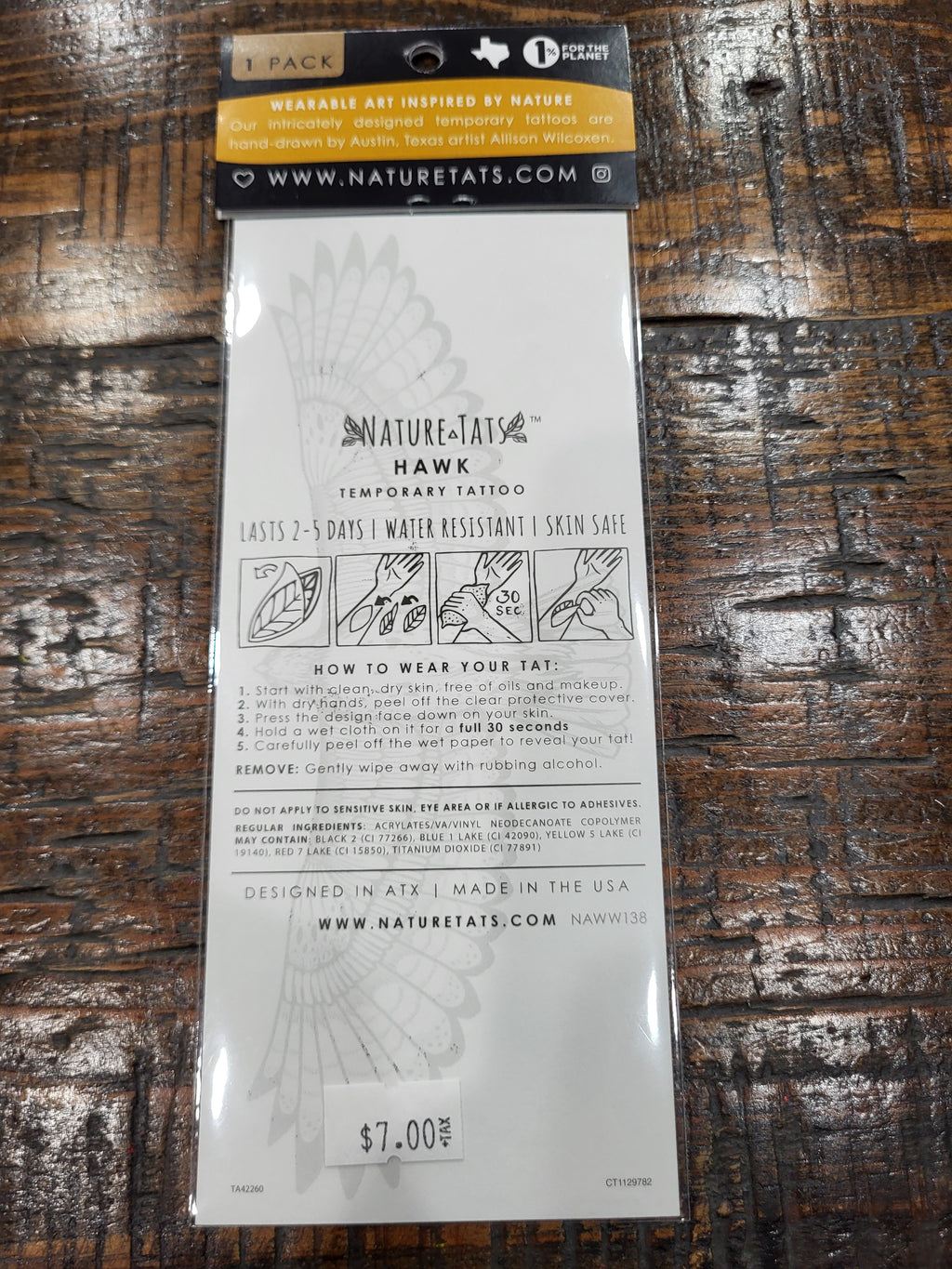 Temporary tattoo package back with hawk design and usage instructions