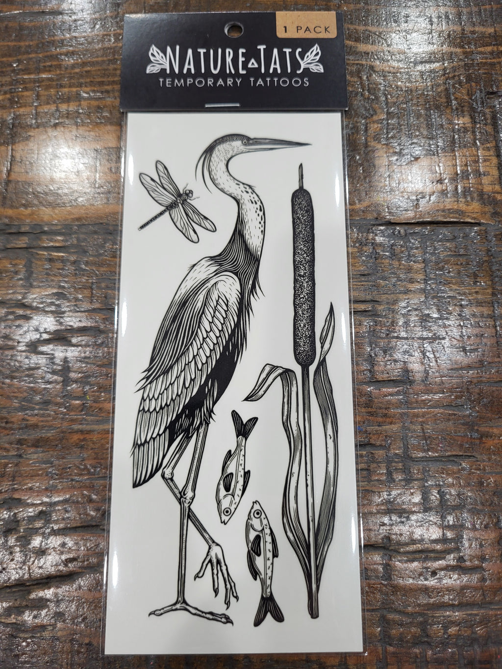 Temporary tattoo pack showing black lake-life animal designs on a card