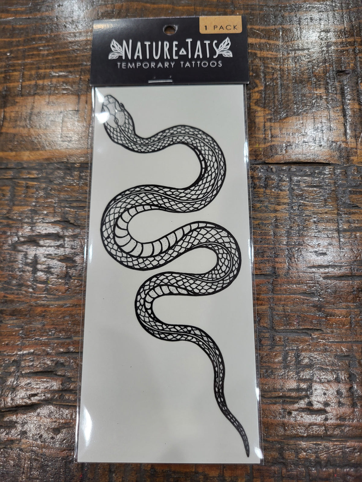 NatureTats temporary tattoo pack with black line drawing of a garden snake
