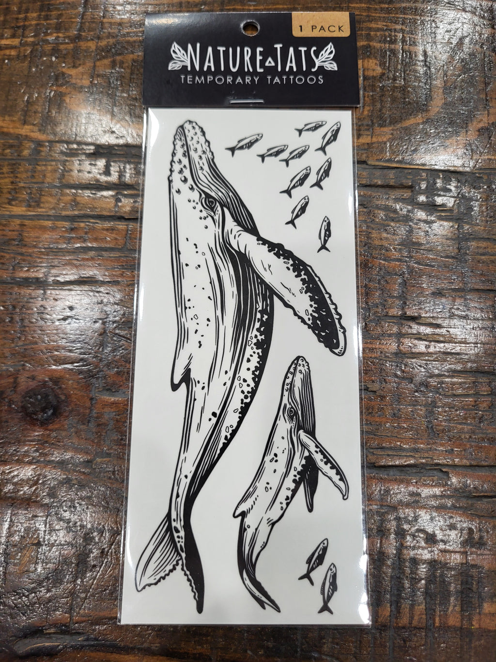 Blue whale temporary tattoo sheet in pack, black whale illustration on white backing