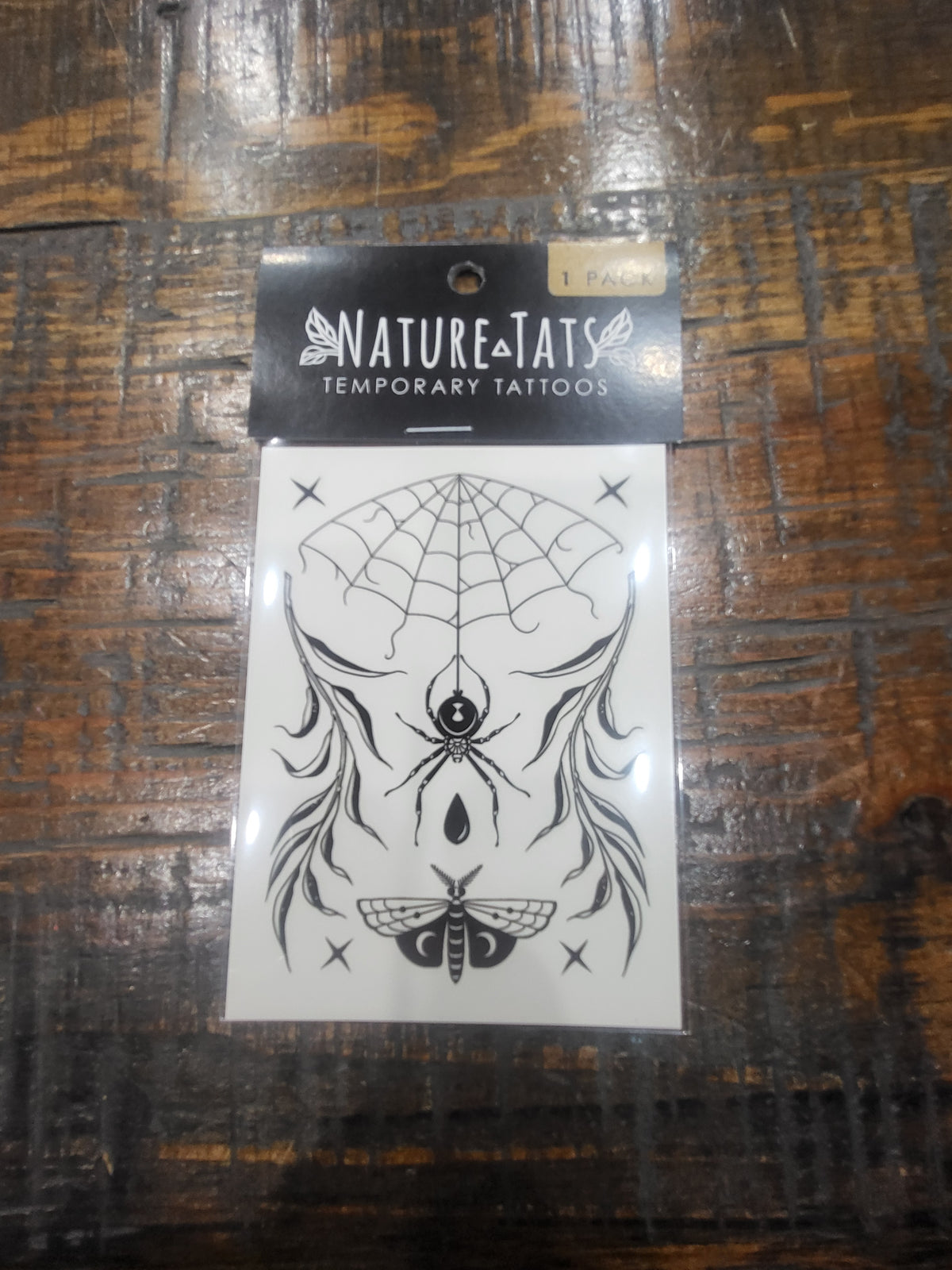 NatureTats temporary tattoo sheet, spiderweb dreamcatcher with feather and stars