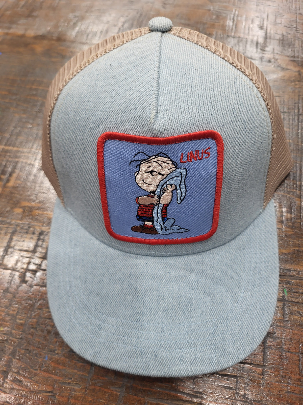 Light blue cotton mesh trucker hat with Peanuts Linus front patch