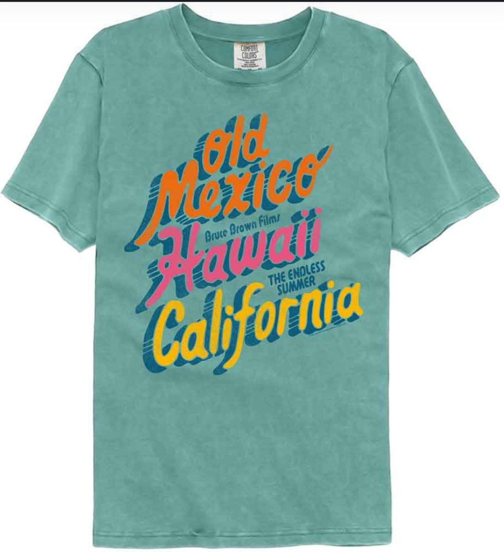 Seafoam teal graphic T-shirt with multicolor 'Old Mexico Hawaii California' text