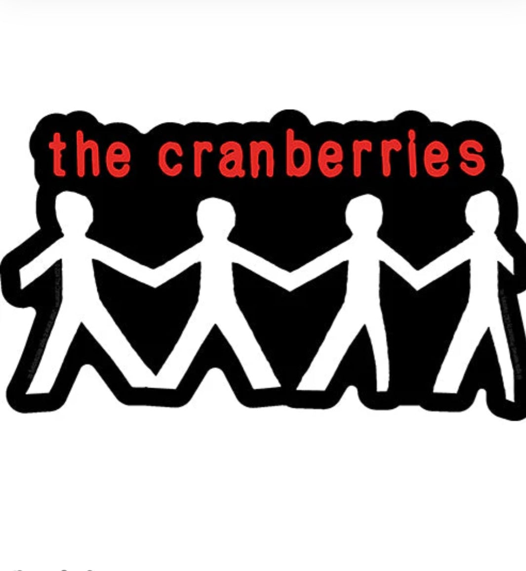 Music band sticker with black-and-red text "the cranberries" over white zigzag figures
