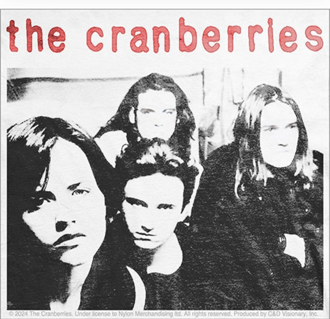 The Cranberries band sticker with red title text and black-and-white group portrait