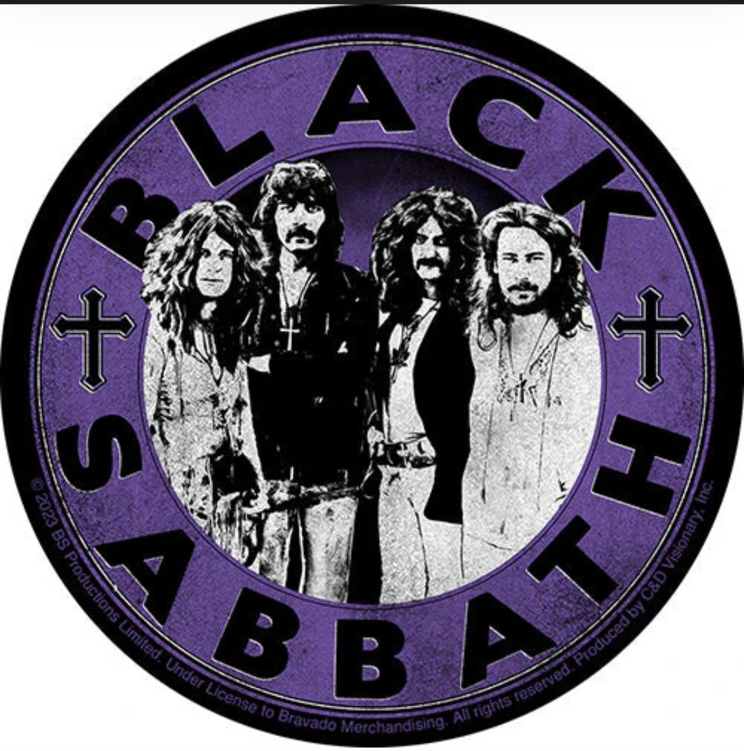 Purple circular band sticker with four members in black-and-white photo