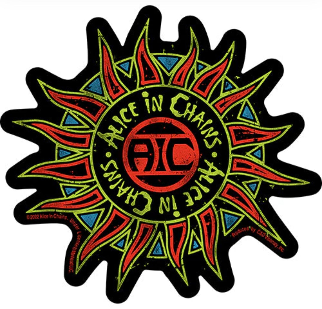 Band sticker with red circular logo and spiky multicolor starburst