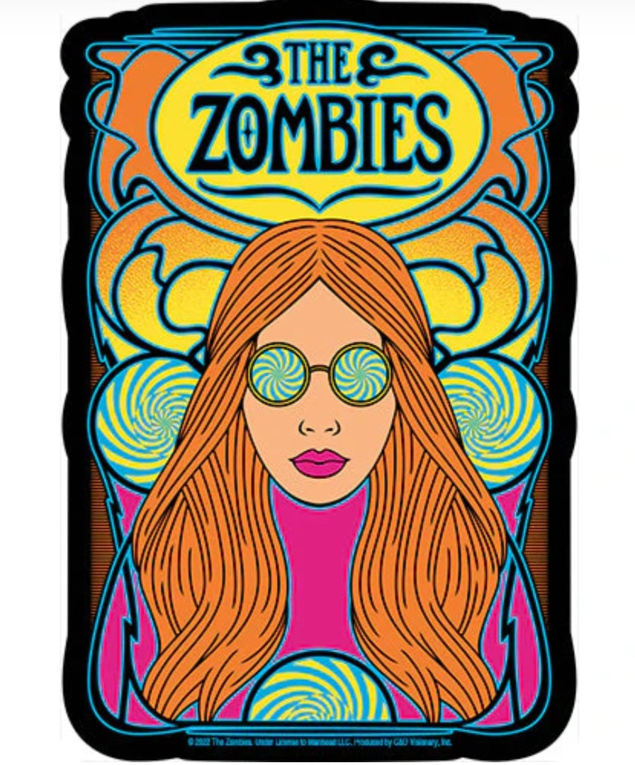The Zombies band sticker with illustrated woman, orange hair, green glasses, and band title text.