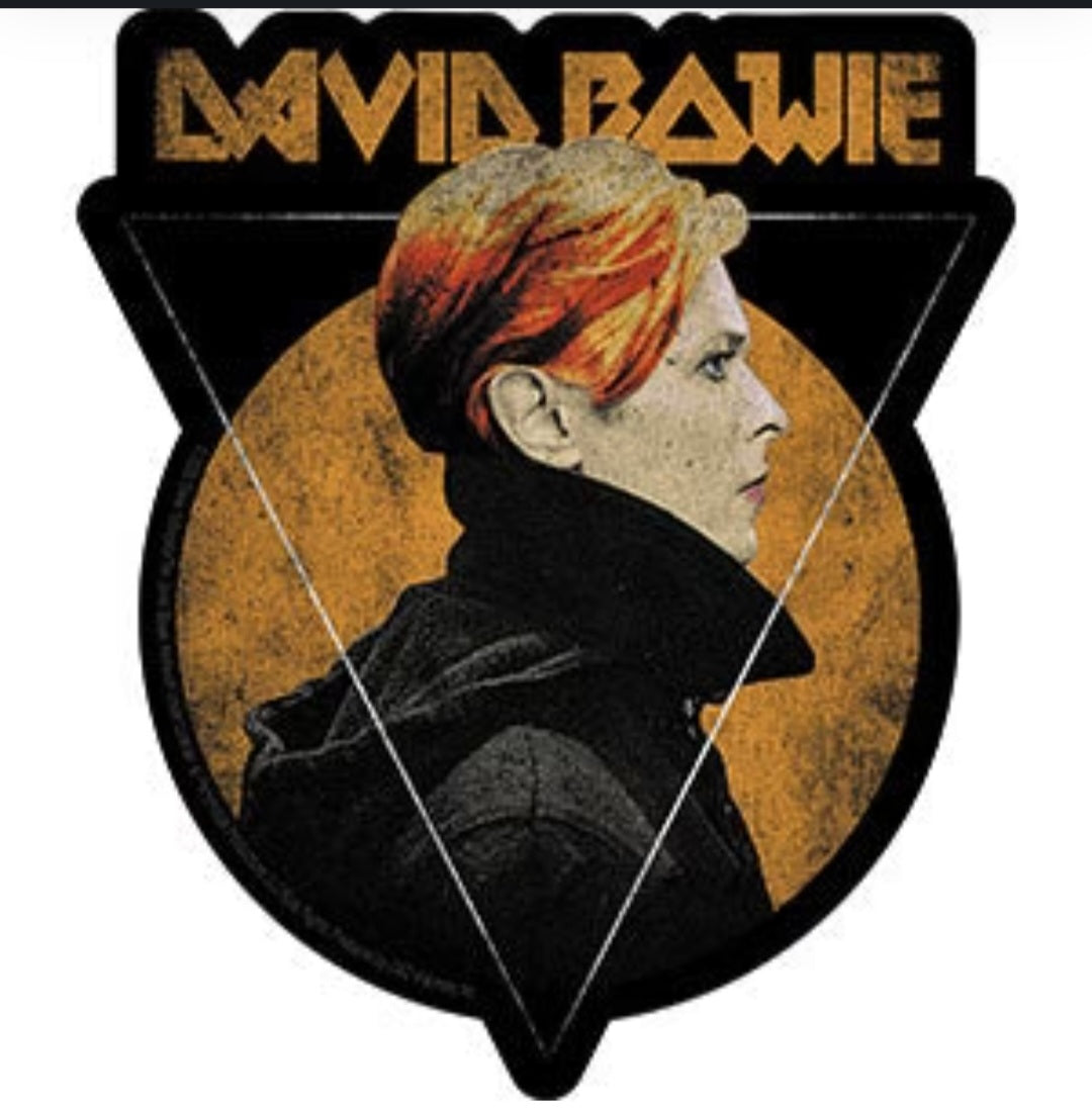 Graphic band sticker with David Bowie profile in black, gold, and multicolor text