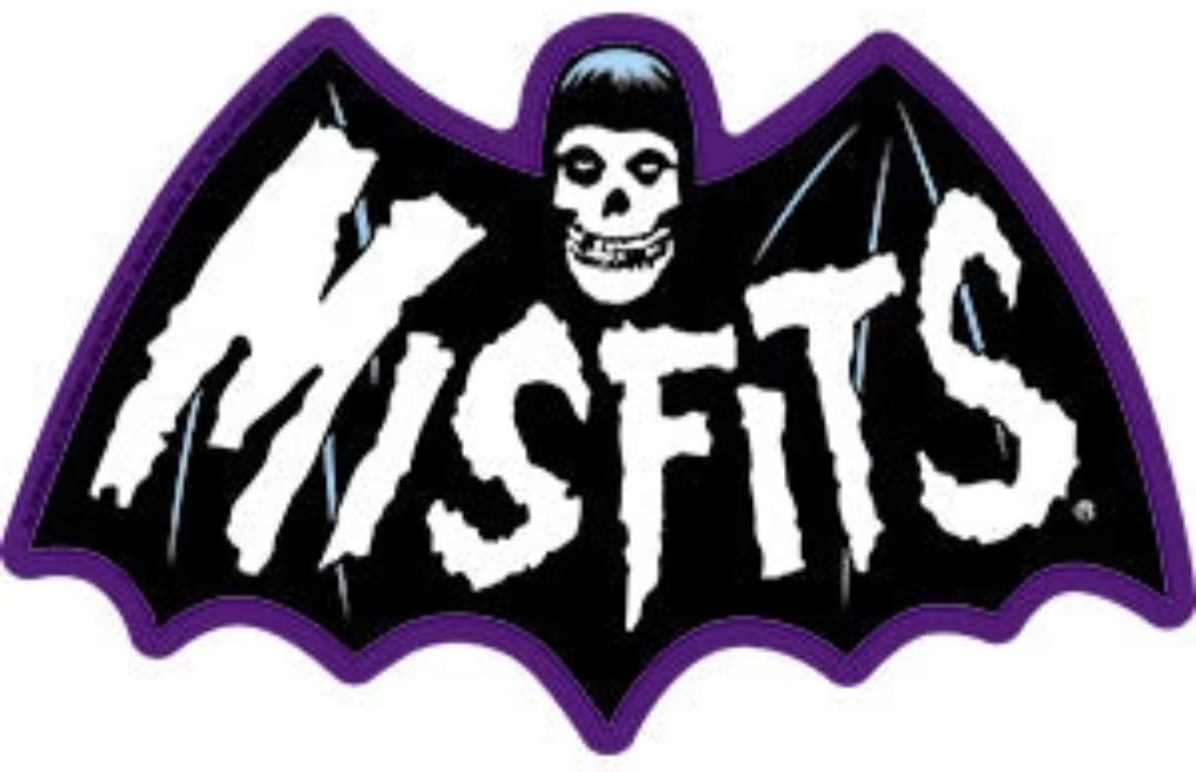 Purple bat-shaped band sticker with skull face and bold black-and-white MISFITS text