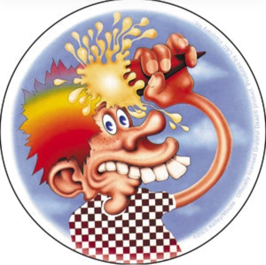 Round cartoon band sticker with smiling character, flames, and checkered shirt
