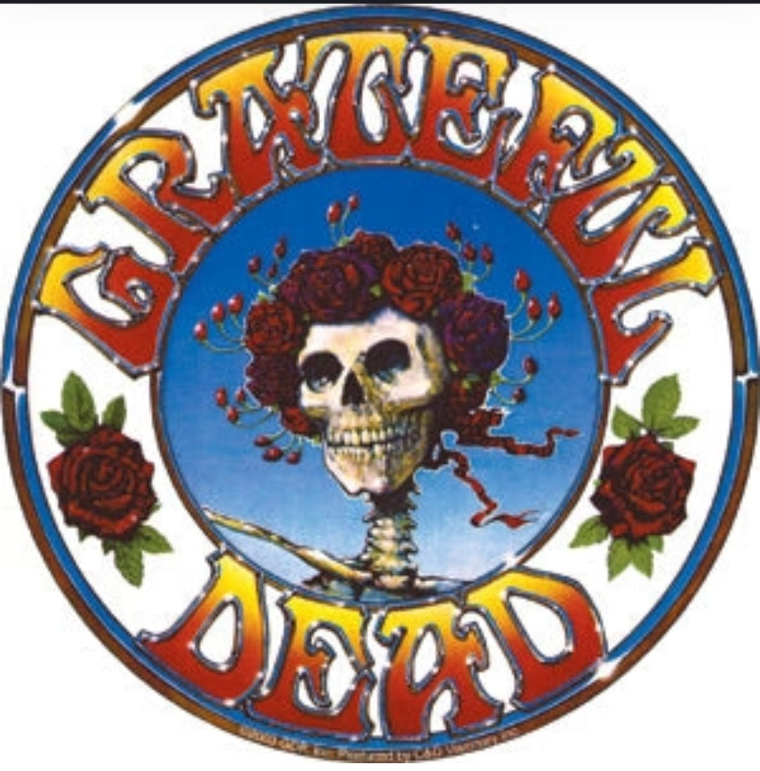 Grateful Dead band sticker, round design with skull, red roses, and arched lettering