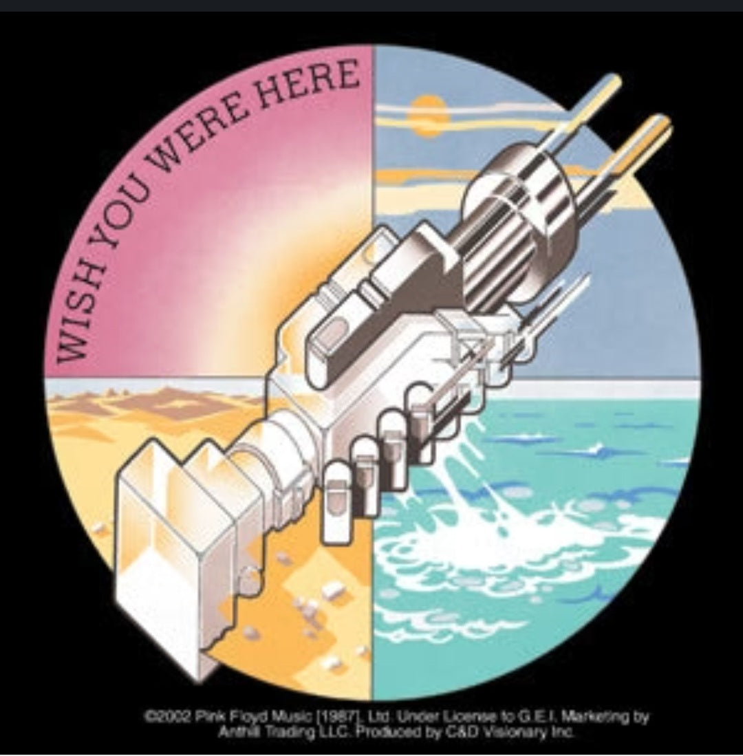 Circular Pink Floyd sticker with rocket-like device, beach/ocean split scene and Wish You Were Here