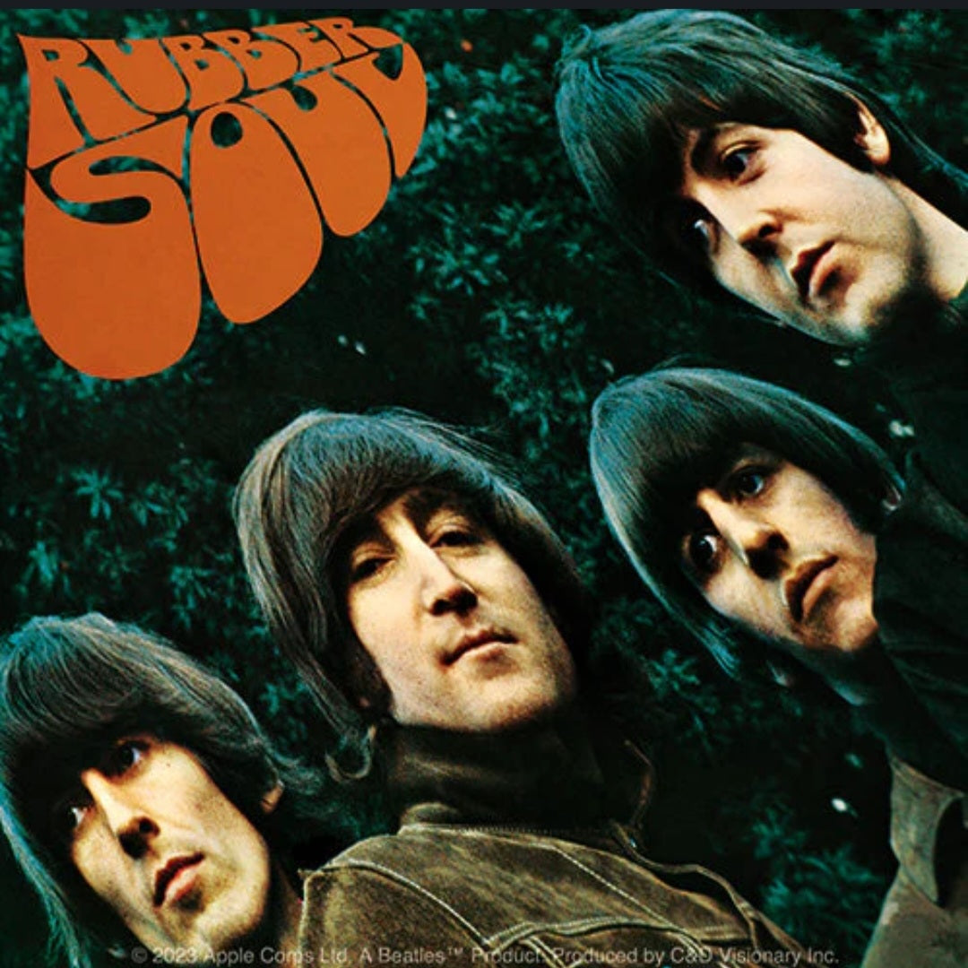 The Beatles band sticker with orange lettering and four band member portraits