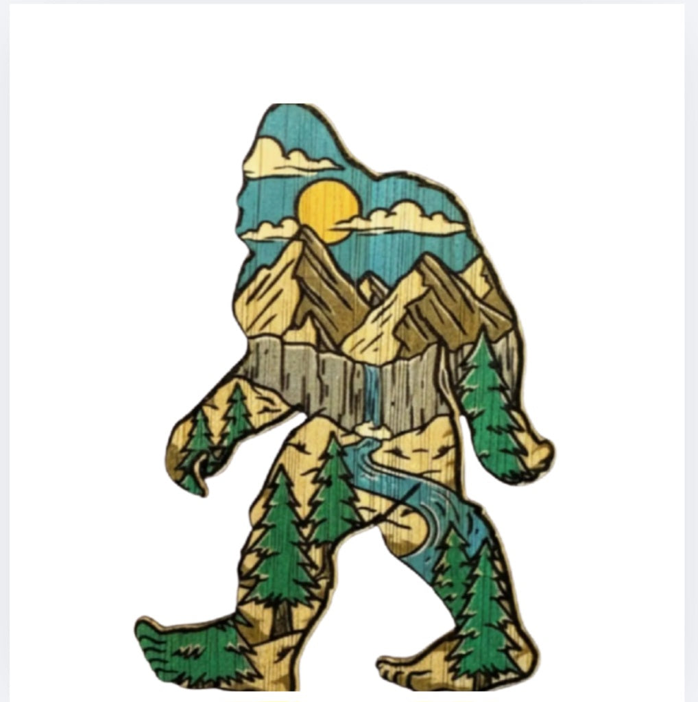 Walking Bigfoot vinyl sticker with forest trees and mountains landscape
