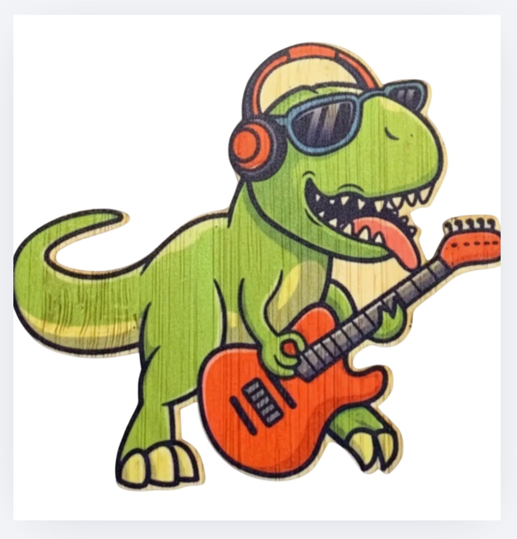 Bamboo sticker of a green dinosaur wearing headphones and playing an orange guitar