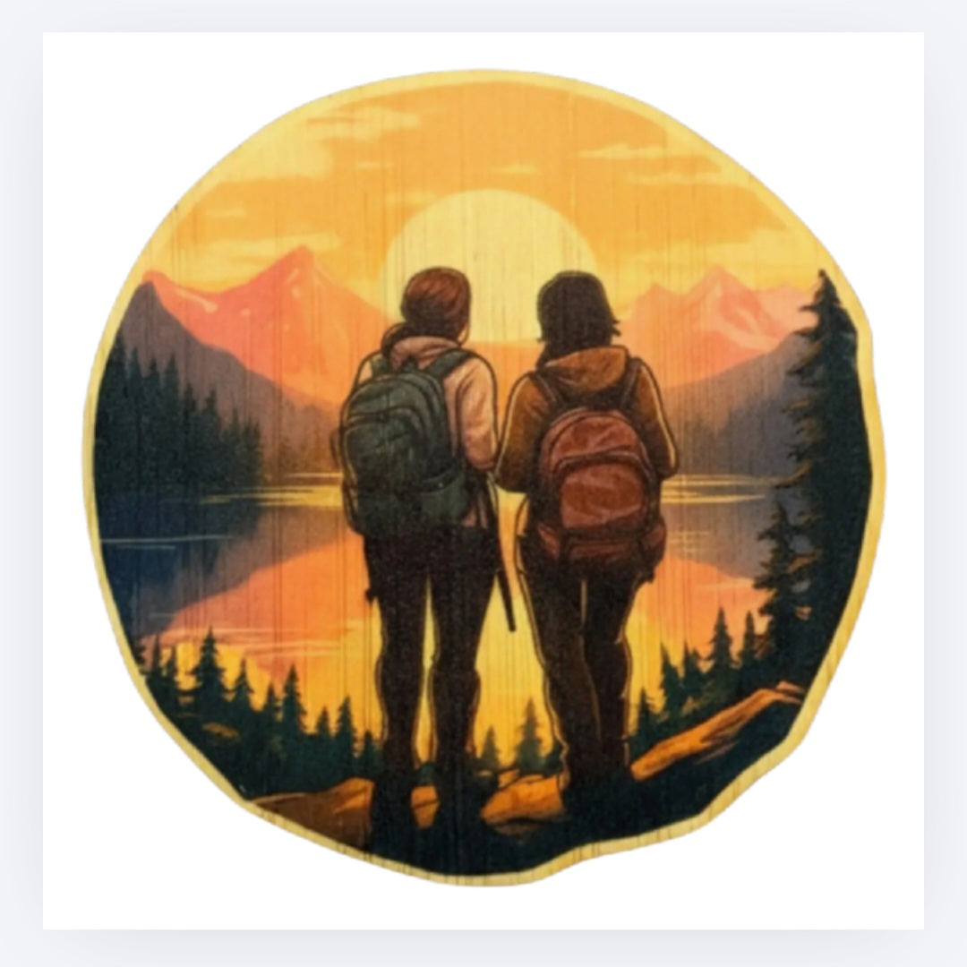 Circular bamboo hiking couple sticker with two hikers walking toward mountain landscape