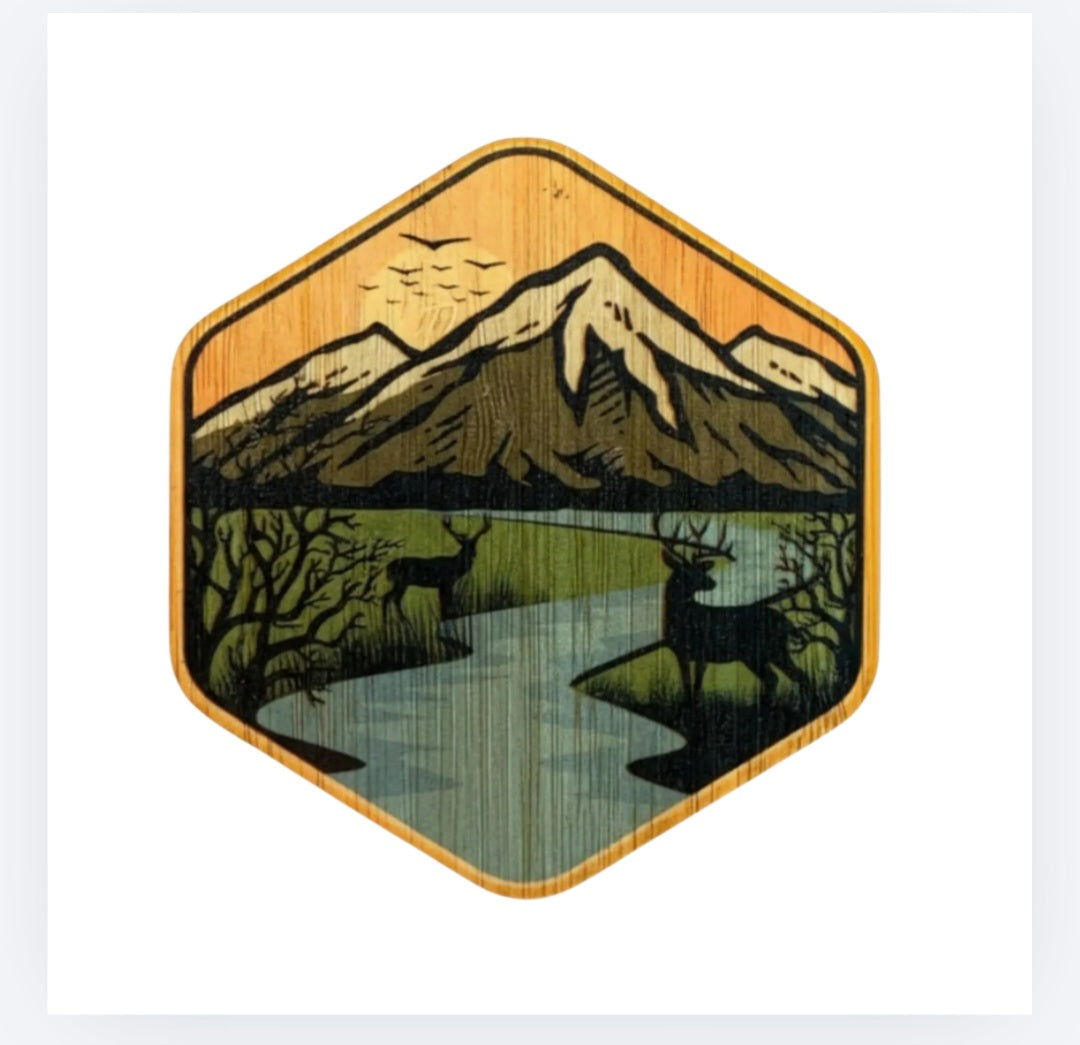 Bamboo sticker with mountains, trees, and a calm stream in a square badge
