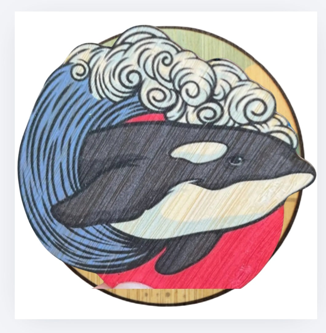 Bamboo sticker, round with stylized orca wave design and red accents
