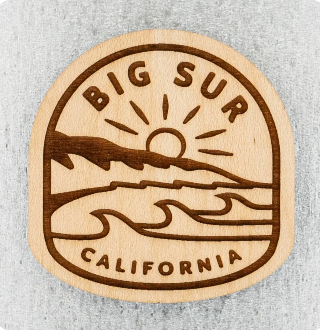 Wood magnet with circular Big Sur engraving, sun, waves, mountains, and California text