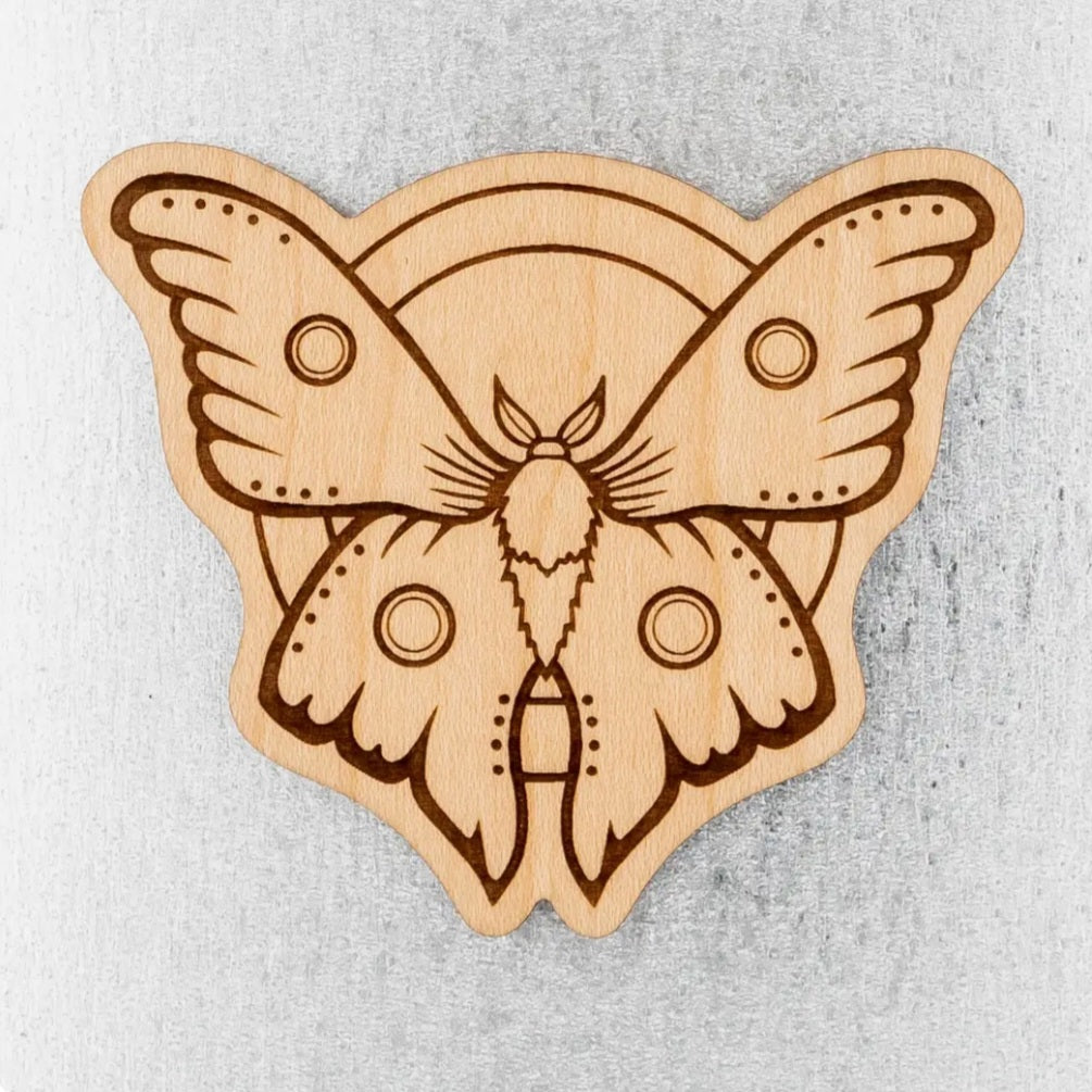 Wood moth magnet with wings spread, engraved moth design in light tan