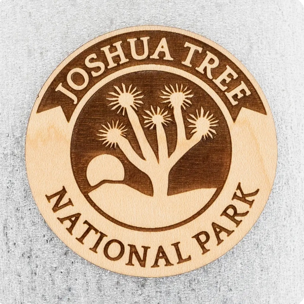 Round wood magnet with Joshua Tree National Park logo and desert tree design