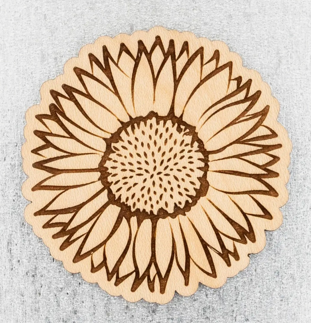 Wood sunflower magnet with layered petals and dotted seed center