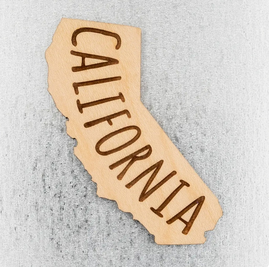 California state wood magnet shaped like California with carved 'CALIFORNIA' lettering