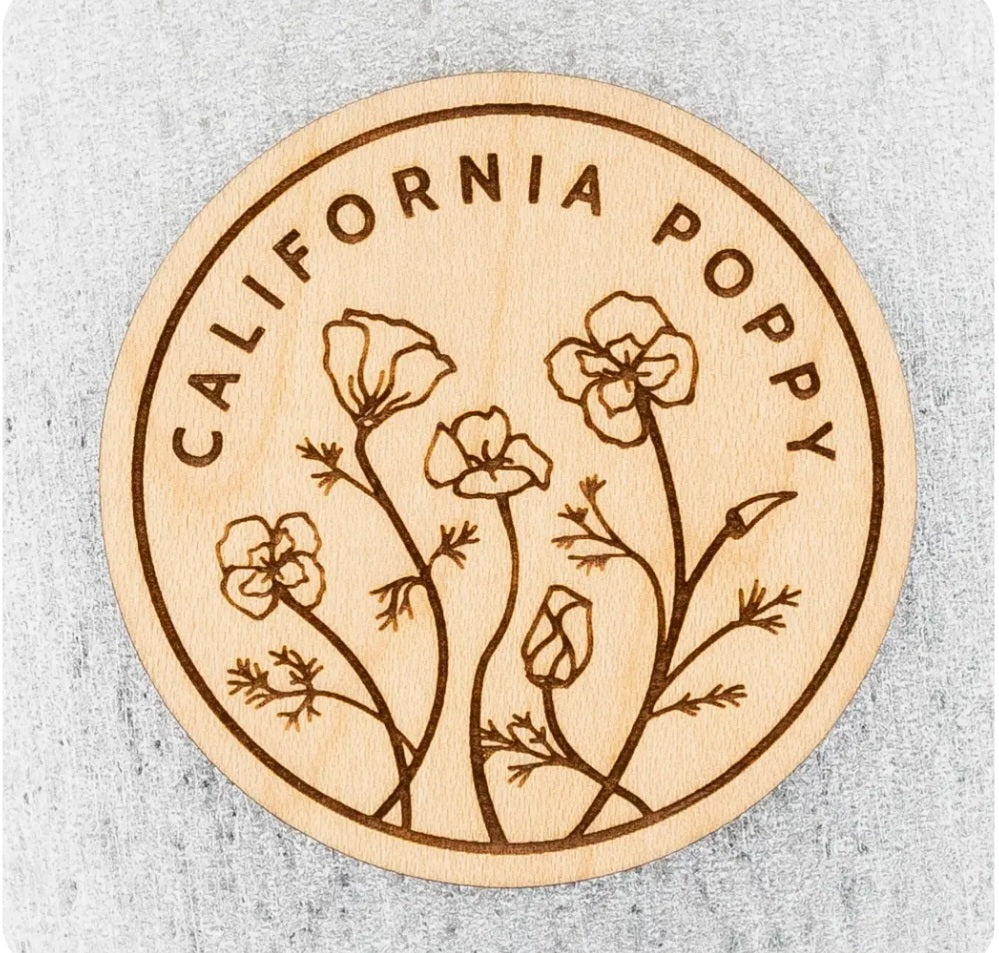 Round wood magnet with poppy floral engraving and text CALIFORNIA POPPY