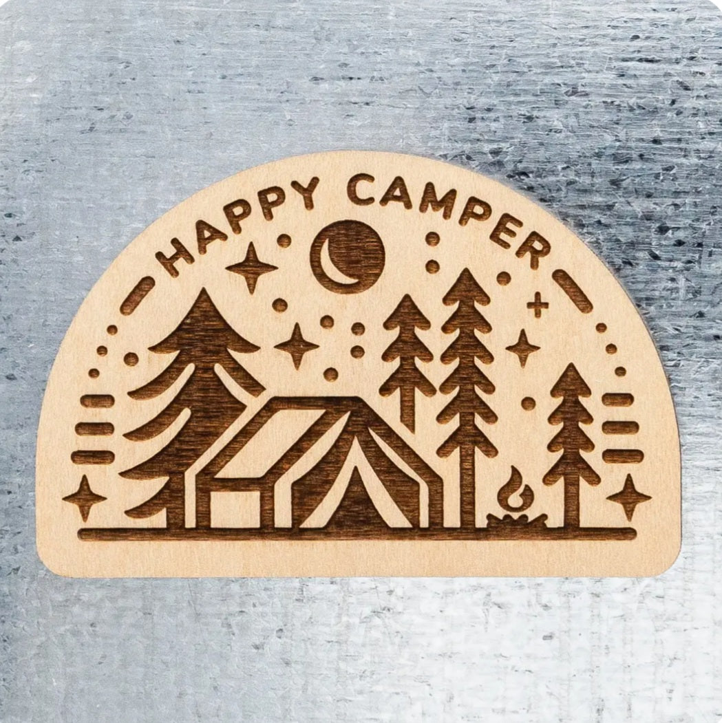 Happy Camper wood magnet with engraved camping scene: cabin, trees, moon and stars