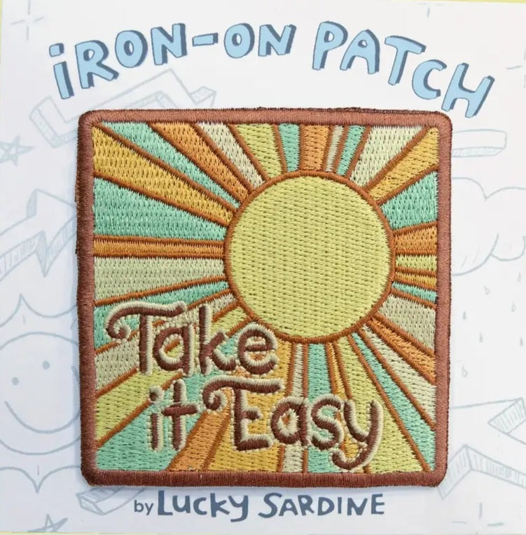 Iron-on patch: rectangular sunburst design with 'Take It Easy' text