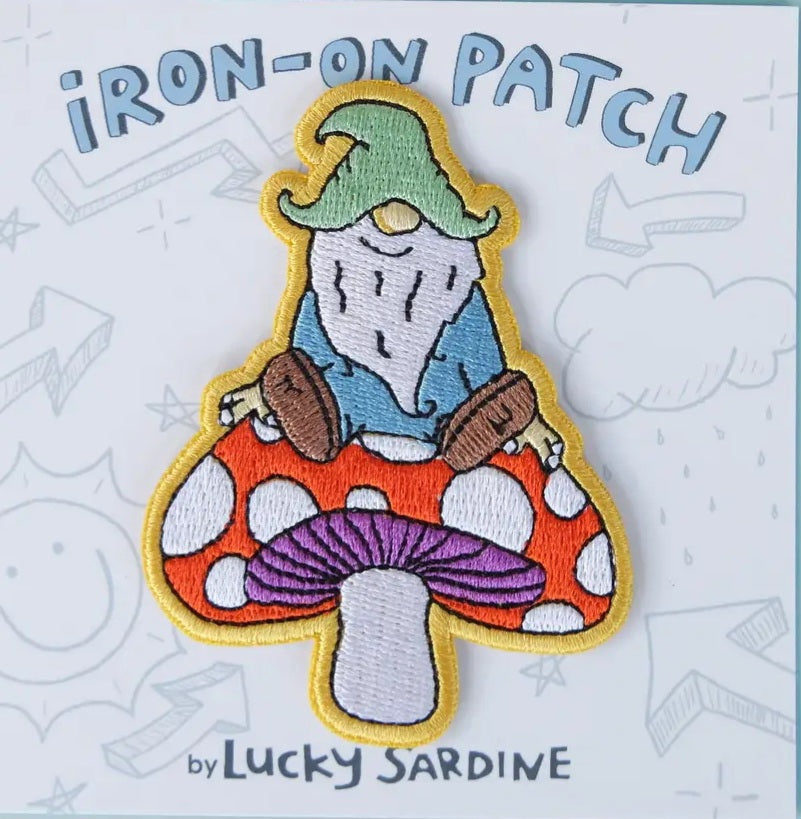 Gnome on mushroom iron-on patch, embroidered blue hat, white beard, red mushroom cap