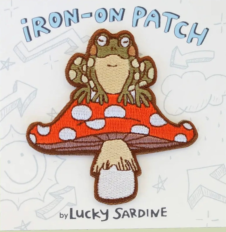 Iron-on patch: brown toad on red mushroom with white dots, Lucky Sardine.