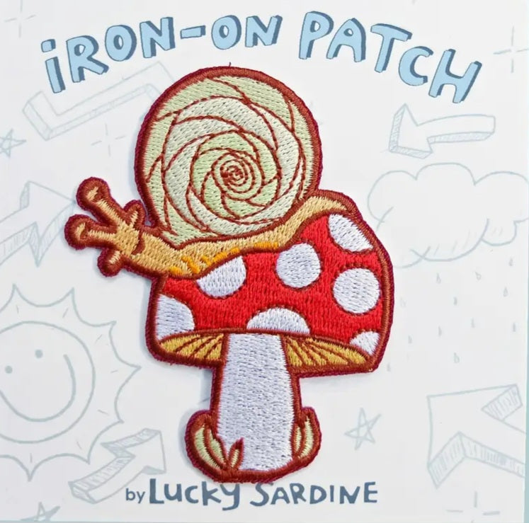 Iron-on patch: embroidered red mushroom with white spots and a tan spiral snail