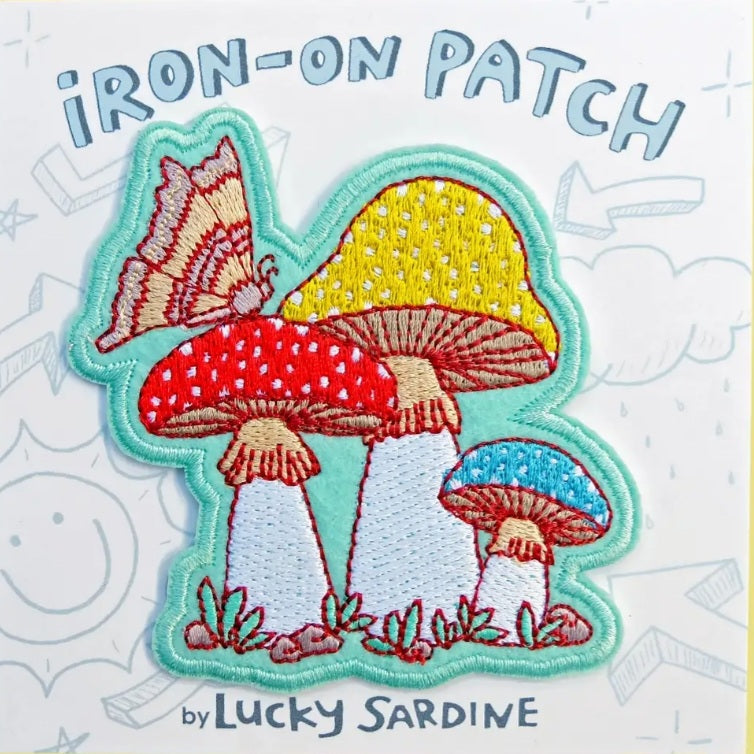 Embroidered iron-on patch with three embroidered mushrooms and a red moth