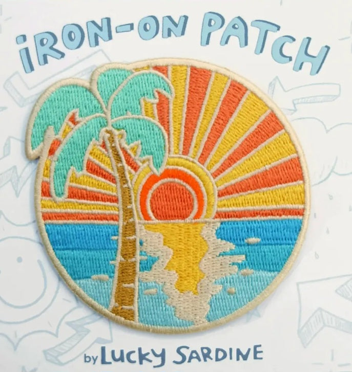 Embroidered iron-on patch with turquoise ocean waves and orange-yellow sunset sun